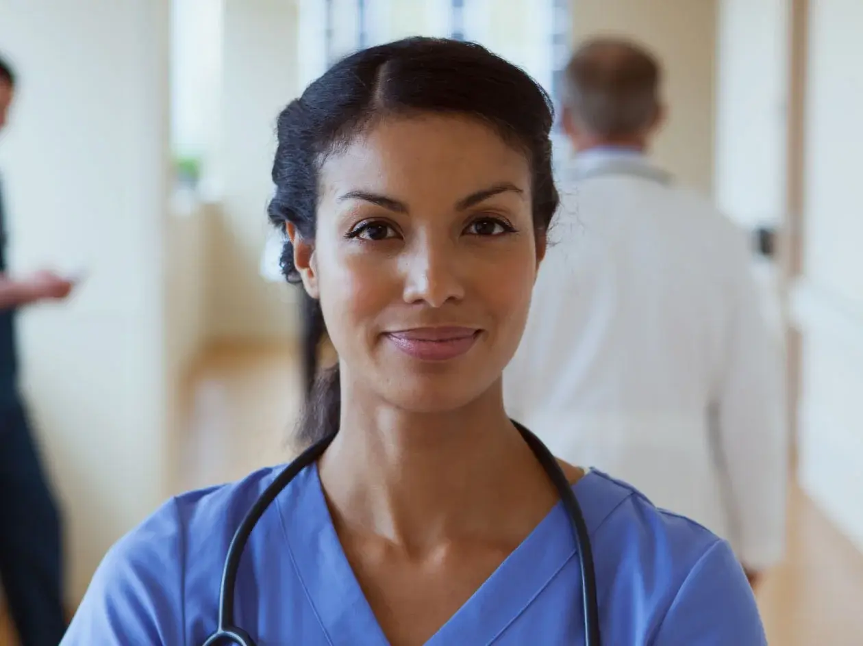 Smiling healthcare worker in scrubs