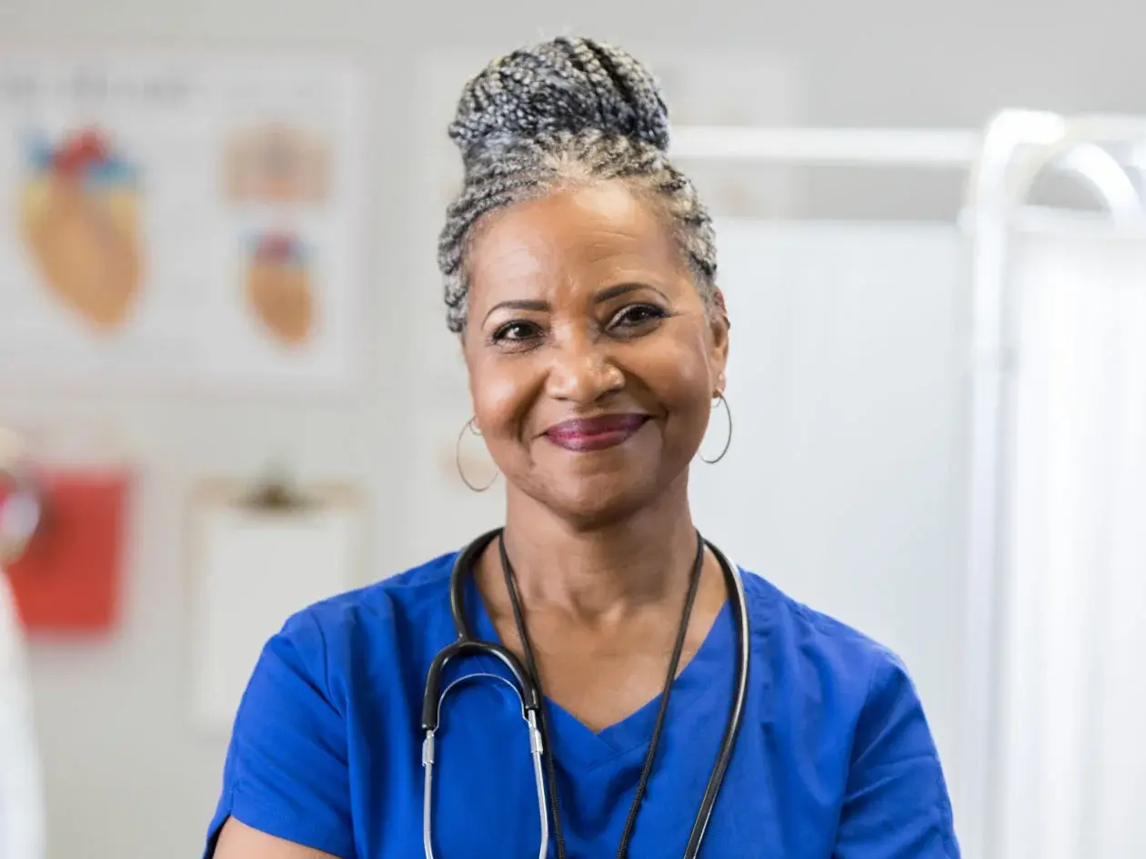 Headshot of smiling nurse with stethoscope around her neck