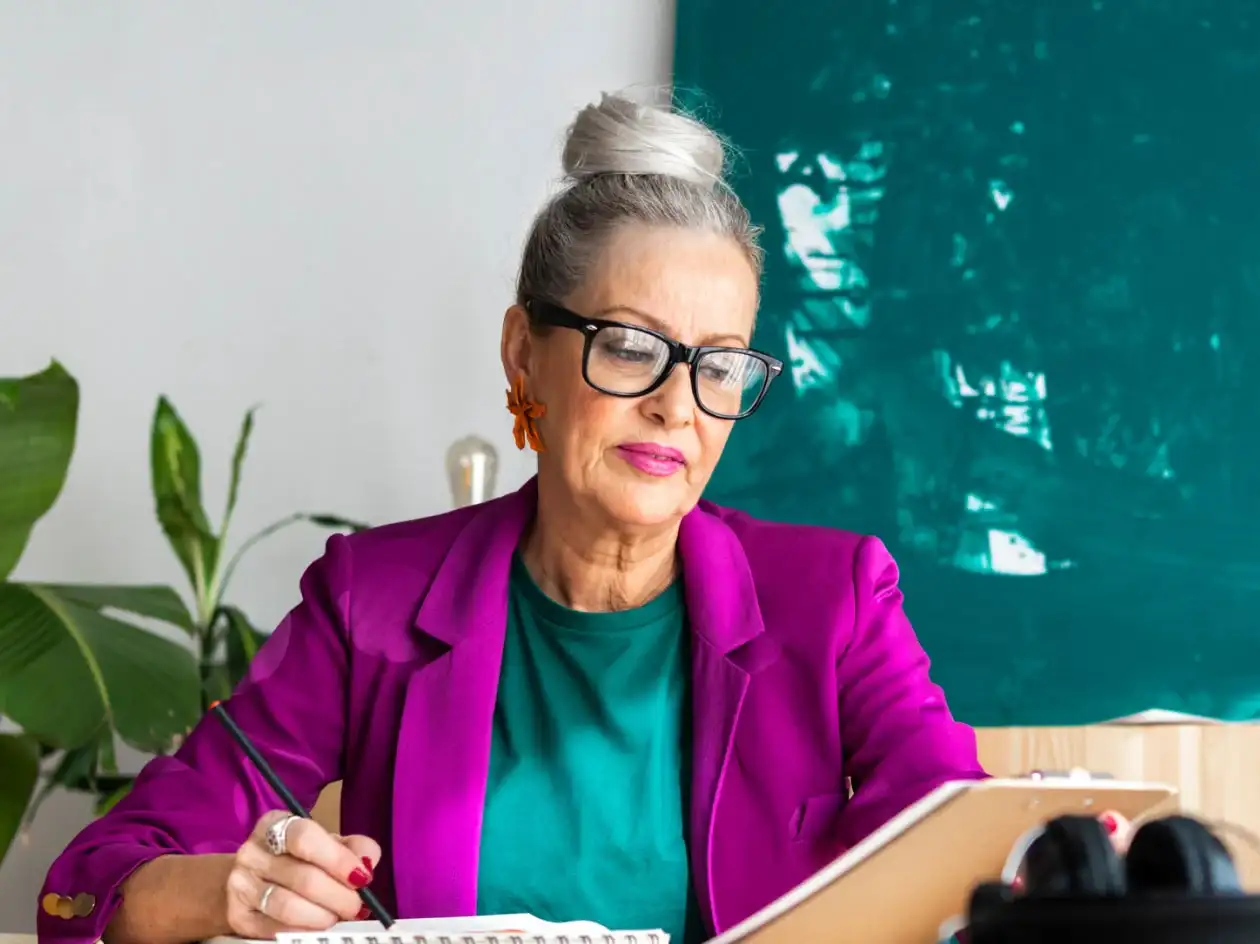 Woman reviewing patient experience data on a clipboard