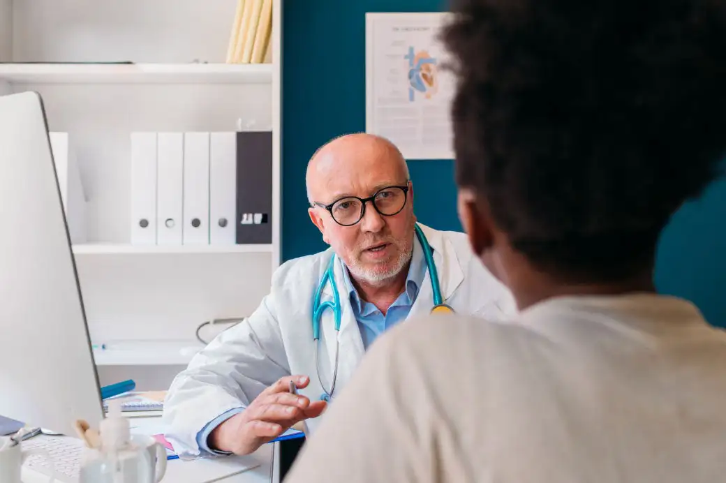 Healthcare provider speaking with patient