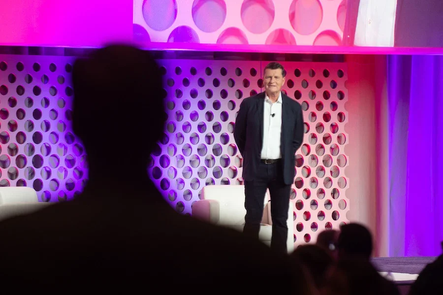 Press Ganey CEO addresses NCC 2022 on stage in Orlando, Florida.